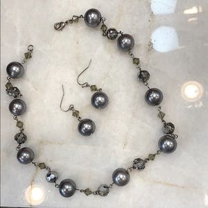 Necklace and earring duo on a silver chain